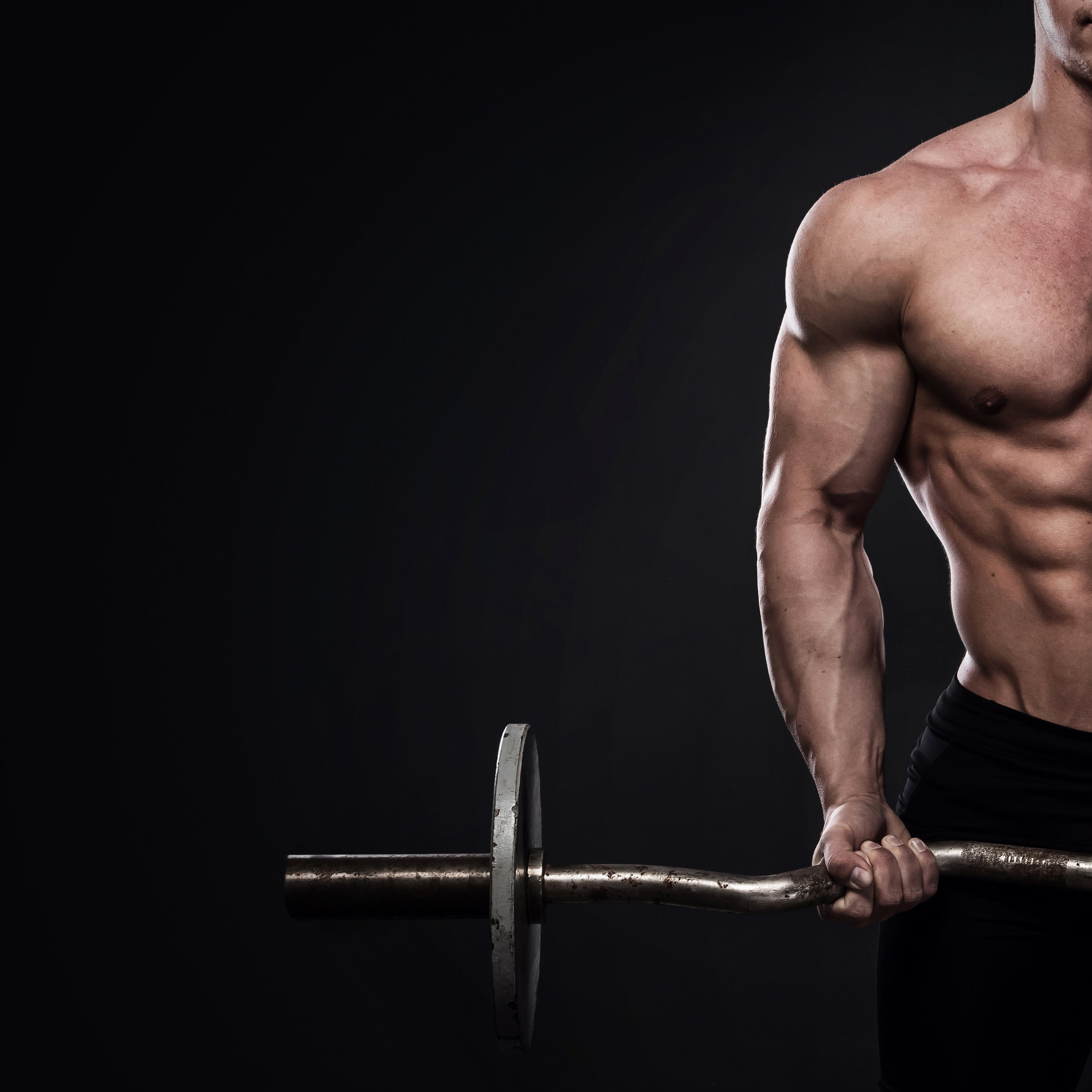 Young bodybuilder with barbell